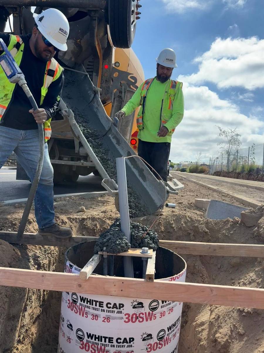 Crew members placing concrete at a Holder job site.