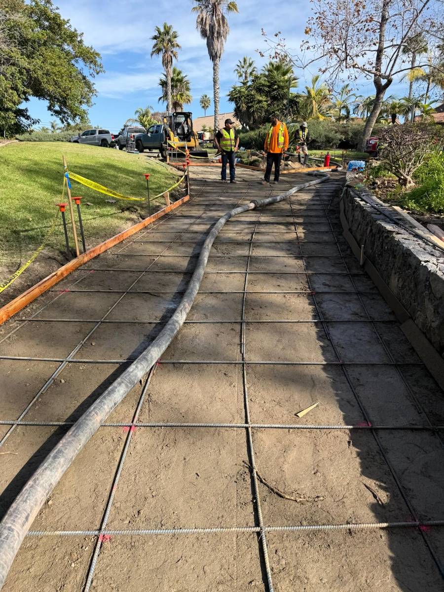 A newly formed concrete sidewalk and curb on a Holder site-improvement project.